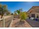 Cozy backyard featuring desert landscaping, a small patio area, and block wall for privacy at 817 S 123Rd Dr, Avondale, AZ 85323