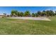 Outdoor basketball court with well-maintained surface and surrounding green space, great for recreation at 817 S 123Rd Dr, Avondale, AZ 85323