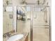 Close up on the shower in the bathroom featuring dual sinks, a granite countertop, and glass shower at 817 S 123Rd Dr, Avondale, AZ 85323