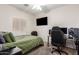 View of a bedroom featuring a large bed and TV, perfect for rest and relaxation at 817 S 123Rd Dr, Avondale, AZ 85323