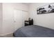 This is a bedroom featuring a closet with white doors and gray carpet at 817 S 123Rd Dr, Avondale, AZ 85323