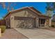 Single-story home with a large two car garage and desert landscaping at 817 S 123Rd Dr, Avondale, AZ 85323