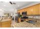 Bright kitchen featuring stainless steel appliances and granite countertops at 817 S 123Rd Dr, Avondale, AZ 85323