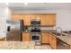 Bright kitchen featuring stainless steel appliances, granite countertops, and light wood cabinetry at 817 S 123Rd Dr, Avondale, AZ 85323