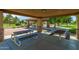 Covered picnic area with multiple picnic tables and stone pillars, perfect for outdoor gatherings at 817 S 123Rd Dr, Avondale, AZ 85323