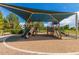 Shaded playground with slides and climbing structures, great for ' outdoor fun and recreation at 817 S 123Rd Dr, Avondale, AZ 85323