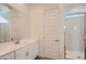 Modern bathroom with double vanity, quartz counters, and glass-enclosed shower at 855 W Peralta Pass, Apache Junction, AZ 85120