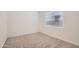 A bedroom featuring neutral carpet and white walls providing a calming and serene space at 855 W Peralta Pass, Apache Junction, AZ 85120
