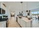 Open concept kitchen featuring a large island, modern appliances, and seamless flow to the living room at 855 W Peralta Pass, Apache Junction, AZ 85120