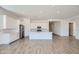 Modern kitchen featuring white cabinets, stainless steel appliances, and a large island with a sink at 855 W Peralta Pass, Apache Junction, AZ 85120