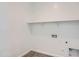 Laundry room with wood-look vinyl floors and shelving at 855 W Peralta Pass, Apache Junction, AZ 85120