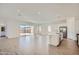Spacious living room featuring an open floor plan, modern finishes, and sliding glass doors to the backyard at 855 W Peralta Pass, Apache Junction, AZ 85120