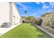 Green backyard featuring turf, a privacy fence, and desert landscaping at 9167 E Tarantini Ln, Scottsdale, AZ 85260