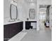 Bright bathroom featuring double sinks with dark cabinetry and modern fixtures at 9167 E Tarantini Ln, Scottsdale, AZ 85260
