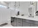 Bathroom with dual sinks, pendant lighting, and modern fixtures at 9167 E Tarantini Ln, Scottsdale, AZ 85260