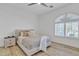 Cozy bedroom with a neutral palette, a ceiling fan, and a window with shutter blinds at 9167 E Tarantini Ln, Scottsdale, AZ 85260