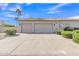 Two-car garage with a paved driveway and desert landscaping at 9167 E Tarantini Ln, Scottsdale, AZ 85260
