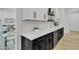 Kitchen counter with sleek white countertops and cabinetry plus a wine refrigerator at 9167 E Tarantini Ln, Scottsdale, AZ 85260