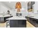 Open kitchen layout featuring a large island, modern appliances, and stylish decor at 9167 E Tarantini Ln, Scottsdale, AZ 85260