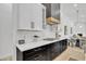 Sleek kitchen with modern cabinetry, countertop appliances, and a view to living space at 9167 E Tarantini Ln, Scottsdale, AZ 85260