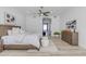 An airy main bedroom with wood floors, and a decorative area rug at 9167 E Tarantini Ln, Scottsdale, AZ 85260