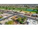 Aerial view of homes in a well-maintained neighborhood with mature trees and easy access to a golf course at 9401 W Raintree Dr, Sun City, AZ 85351