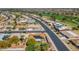 An aerial view of a neighborhood with well-maintained homes and green landscaping, near a golf course at 9401 W Raintree Dr, Sun City, AZ 85351