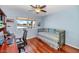 Bright bedroom features hardwood floors and a comfortable daybed at 9401 W Raintree Dr, Sun City, AZ 85351