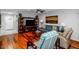 Open concept living room featuring hardwood floors and comfortable seating at 9401 W Raintree Dr, Sun City, AZ 85351