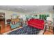 Bright living room featuring hardwood floors and a cozy seating arrangement at 9401 W Raintree Dr, Sun City, AZ 85351