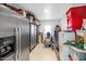 Well-organized storage room with ample shelving, metal cabinets, and stacked storage containers at 9401 W Raintree Dr, Sun City, AZ 85351