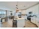 Modern kitchen featuring white cabinets, stainless steel appliances, and a large island at 9718 S Centennial Rd, Apache Junction, AZ 85120