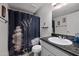 Modern bathroom with stone accents and a floral shower curtain at 985 N Granite Reef Rd # 127, Scottsdale, AZ 85257