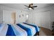 Bright bedroom featuring a ceiling fan, closet, and connecting bathroom at 985 N Granite Reef Rd # 127, Scottsdale, AZ 85257