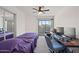 Bedroom with a workspace and sliding glass door leading outside to a patio at 985 N Granite Reef Rd # 127, Scottsdale, AZ 85257