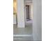 Hallway entrance featuring textured walls and view into the laundry room at 985 N Granite Reef Rd # 127, Scottsdale, AZ 85257