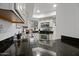 A kitchen featuring granite countertops, stainless steel appliances, and white cabinetry providing modern appeal at 985 N Granite Reef Rd # 127, Scottsdale, AZ 85257