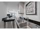 A kitchen featuring stainless steel dishwasher, granite countertops and a stainless steel sink at 985 N Granite Reef Rd # 127, Scottsdale, AZ 85257