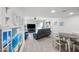 Open-concept living room with a comfortable seating area, dining area, and sliding glass door for ample natural light at 985 N Granite Reef Rd # 127, Scottsdale, AZ 85257