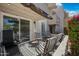 Cozy patio with string lights, patio furniture, and colorful blooming bushes create a peaceful outdoor space at 985 N Granite Reef Rd # 127, Scottsdale, AZ 85257