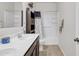 Well-lit bathroom featuring double sinks, dark wood cabinets, and a shower-tub combination at 10320 E Lupine Ln, Florence, AZ 85132