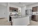 Modern kitchen featuring granite countertops, stainless steel appliances, and ample cabinet space at 10320 E Lupine Ln, Florence, AZ 85132