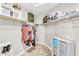 Well-organized walk-in closet with ample shelving and hanging space for efficient storage solutions at 108 N Pioneer St, Gilbert, AZ 85233