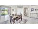 Inviting dining area featuring a wooden table set, modern tile flooring and slider leading to the patio at 108 N Pioneer St, Gilbert, AZ 85233