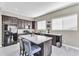 Modern kitchen featuring stainless steel appliances, a large island with seating, and ample counter space at 108 N Pioneer St, Gilbert, AZ 85233