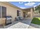 Enjoy outdoor living on this home's covered patio, featuring comfortable seating and a built-in grill at 108 N Pioneer St, Gilbert, AZ 85233