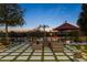 Backyard patio with comfortable lounge seating and view of the pool with lush desert landscaping at 10800 E Cactus Rd # 38, Scottsdale, AZ 85259