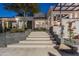 Stunning home at dusk showcasing a grand staircase entrance and contemporary design elements for curb appeal at 10800 E Cactus Rd # 38, Scottsdale, AZ 85259