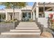 Stunning home showcasing a grand staircase entrance and contemporary design elements for curb appeal at 10800 E Cactus Rd # 38, Scottsdale, AZ 85259