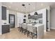 Modern kitchen featuring a large island, pendant lighting, and an open design at 10800 E Cactus Rd # 38, Scottsdale, AZ 85259